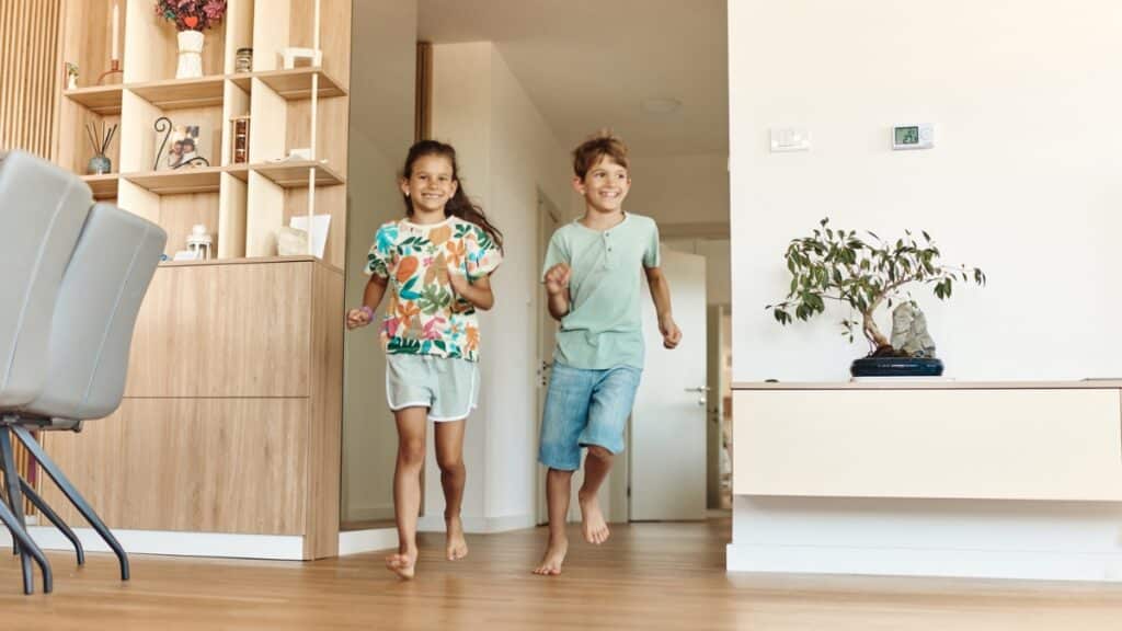 Children enjoying a clean home after professional residential cleaning.